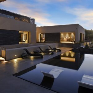 A large pool with lights on the side of it